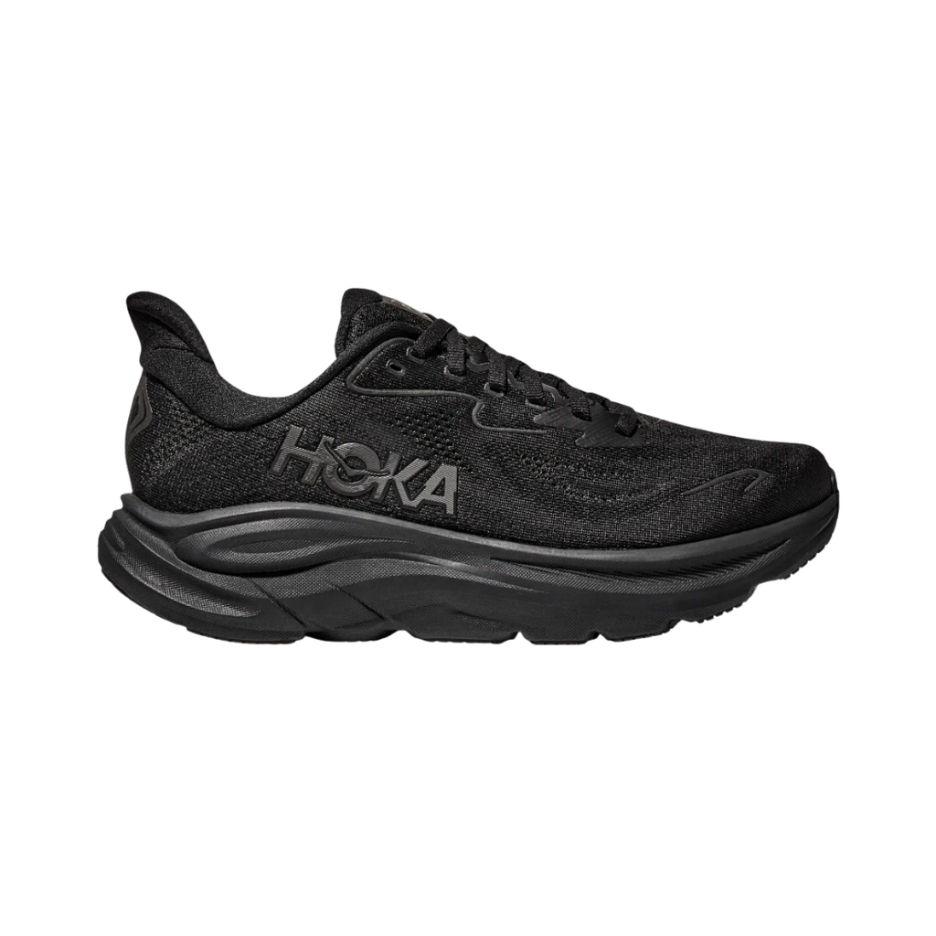 Side view of the HOKA Men’s Clifton 10 in Black/Black, showcasing the lightweight jacquard knit upper, plush CMEVA midsole cushioning, and smooth MetaRocker™ geometry for a soft, efficient ride.